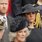 
              FILE - Britain's King Charles III, from bottom left, Camilla, the Queen Consort, Prince Harry and Meghan, Duchess of Sussex watch as the coffin of Queen Elizabeth II is placed into the hearse following the state funeral service in Westminster Abbey in central London Monday Sept. 19, 2022. Prince Harry has defended his memoir that lays bare rifts inside Britain’s royal family. He says in TV interviews broadcast Sunday that he wanted to “own my story” after 38 years of “spin and distortion” by others. (AP Photo/Martin Meissner, Pool, File)
            