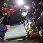 
              A climate activist has entrenched himself in a car, presumably chained, and is freed by police forces using a hydraulic spreader and a flex, in Luetzerath, Germany, Wednesday, Jan. 11, 2023. Environmental activists have been locked in a standoff with police who started eviction operations on Wednesday in the hamlet of Luetzerath, west of Cologne, that's due to be bulldozed for the expansion of a nearby lignite mine. (Thomas Banneyer/dpa via AP)
            