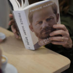 
              A customer reads a copy of the new book by Prince Harry called "Spare" at a book store in Rome, Tuesday, Jan. 10, 2023. Prince Harry's memoir "Spare" arrives in bookstores on Tuesday, providing a varied portrait of the Duke of Sussex and the royal family. (AP Photo/Andrew Medichini)
            