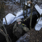 
              A Ukrainian serviceman smokes a cigarette at his position on the frontline near Bakhmut, Donetsk region, Ukraine, Wednesday, Jan. 11, 2023. (AP Photo/Evgeniy Maloletka)
            
