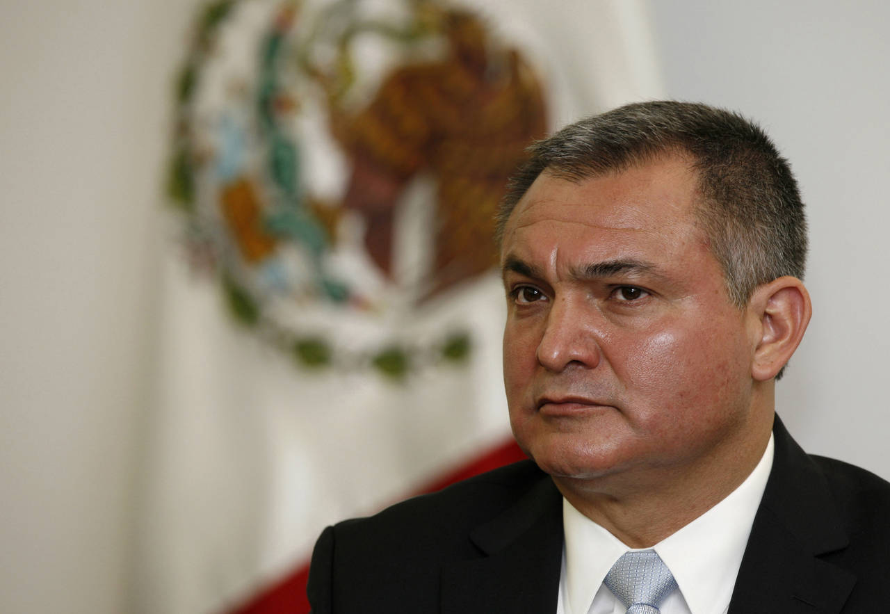 FILE - Mexico's Secretary of Public Safety Genaro Garcia Luna attends a press conference on the sid...