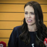 
              New Zealand Prime Minister Jacinda Ardern grimaces as she announces her resignation at a press conference in Napier, New Zealand. Fighting back tears, Ardern told reporters that Feb. 7 will be her last day in office. (Warren Buckland/New Zealand Herald via AP)
            