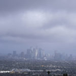 
              Storm clouds blanket the Los Angeles skyline is seen at Kenneth Hahn State Recreation Area following a rainstorm in Los Angeles, Thursday, Jan. 5, 2023. (AP Photo/Ringo H.W. Chiu)
            