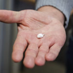 
              Chief police inspector of the Brussels Morolles neighbourhood, Kris Verborgh shows a package of crack cocaine in Brussels, Monday, Jan. 9, 2023. The white plastic-wrapped kernel found on a small-time dealer recently was barely the size of a fingernail and weighed all of 0.2 grams. The "flash" that crack provides though is increasingly felt through the Brussels Marolles neighborhood and any place in Europe where the surge in cocaine supply is hitting hard. (AP Photo/Geert Vanden Wijngaert)
            