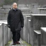 
              The Second Gentleman of the United States, Douglas Emhoff, walks between concrete steles during his visit at the 'Memorial to the Murdered Jews of Europe' in Berlin, Germany, Tuesday, Jan. 31, 2023. (AP Photo/Michael Sohn, pool)
            