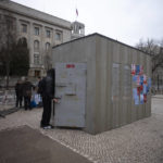 
              A man looks into a replica of a Russian punishment cell in Berlin, Germany, Tuesday, Jan. 24, 2023. Supporters of jailed Alexey Navalny install a replica off the cell in which he has spend 91 days in 2022, opposite the Russian embassy in the German capital, during a demonstration demanding the release of political prisoners in Russia. (AP Photo/Markus Schreiber)
            