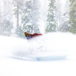 
              A snowboarder slides after one of the most significant storms of the season in Big Bear Mountain Ski resort, with 17" of snow over the last two days in Big Bear Lake, Calif., Sunday, Jan. 15, 2023. The snowfall came just in time for one of the biggest ski weekends of the year. In a three-week series of significant winter storms, the ninth atmospheric river is churning through California on Monday, leaving mountain driving dangerous and flooding risk high near swollen rivers even as the sun came out in some areas. Heavy snow fell across the Sierra Nevada. (Big Bear Mountain Resort via AP)
            