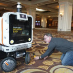
              A member of the media films the Ottobot Yeti as it operates before the start of the CES tech show, Wednesday, Jan. 4, 2023, in Las Vegas. Ottonoy.IO launches Ottobot Yeti at CES 2023. Ottobot Yeti, is a fully autonomous delivery robot that can navigate unattended deliveries for food and beverage retail and curbside deliveries. (AP Photo/Rick Bowmer)
            