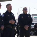 
              A large "Welcome to Mexico" sign hung over the Bridge of the Americas is visible at right as President Joe Biden, left, stands with U.S. Customs and Border Protection officers as he tours the El Paso port of entry, a busy port of entry along the U.S.-Mexico border, in El Paso Texas, Sunday, Jan. 8, 2023. (AP Photo/Andrew Harnik)
            