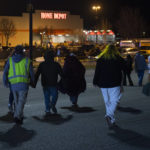 
              Witnesses are directed to Home Depot to escape the cold before being released as police work the scene of a shooting at the West Side Walmart in Evansville, Ind., Thursday, Jan. 19, 2023. Authorities in Indiana say a 25-year-old man opened fire in a Walmart store where he once worked, wounding at least one person before officers fatally shot him. (MaCabe Brown /Evansville Courier & Press via AP)
            