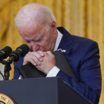 
              FILE - President Joe Biden pauses as he listens to a question about the bombings at the Kabul airport that killed at least 12 U.S. service members, from the East Room of the White House, Aug. 26, 2021, in Washington. (AP Photo/Evan Vucci, File)
            