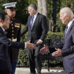 
              President Joe Biden greets Japanese Prime Minister Fumio Kishida on the South Lawn of the White House, Friday, Jan. 13, 2023, in Washington. (AP Photo/Evan Vucci)
            
