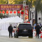 
              Police officers stand outside a ballroom dance club in Monterey Park, Calif., Sunday, Jan. 22, 2023. A mass shooting took place at a dance club following a Lunar New Year celebration, setting off a manhunt for the suspect. (AP Photo/Jae C. Hong)
            