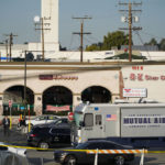 
              Investigators are seen outside Star Dance Studio in Monterey Park, Calif., Sunday, Jan. 22, 2023. A mass shooting took place at the dance club following a Lunar New Year celebration, setting off a manhunt for the suspect. (AP Photo/Jae C. Hong)
            