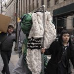 
              Clothes by fashion designer Thom Browne is taken into Manhattan federal court, Monday, Jan. 9, 2023, in New York. (AP Photo/Yuki Iwamura)
            