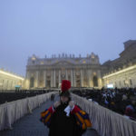 
              A guard stands as the fog covers the St. Peter's Basilica Dome in St. Peter's Square at the Vatican ahead of the funeral mass for late Pope Emeritus Benedict XVI, Thursday, Jan. 5, 2023. Benedict died at 95 on Dec. 31 in the monastery on the Vatican grounds where he had spent nearly all of his decade in retirement, his days mainly devoted to prayer and reflection. (AP Photo/Alessandra Tarantino)
            