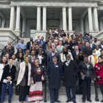 
              In this photo provided by Archana Sahgal, participants and funders of the Community Violence Intervention Collaborative gather for a photo at the Eisenhower Executive Office Building in Washington, D.C. on Dec. 8, 2022. (AP Photo/Archana Sahgal/Hyphen)
            