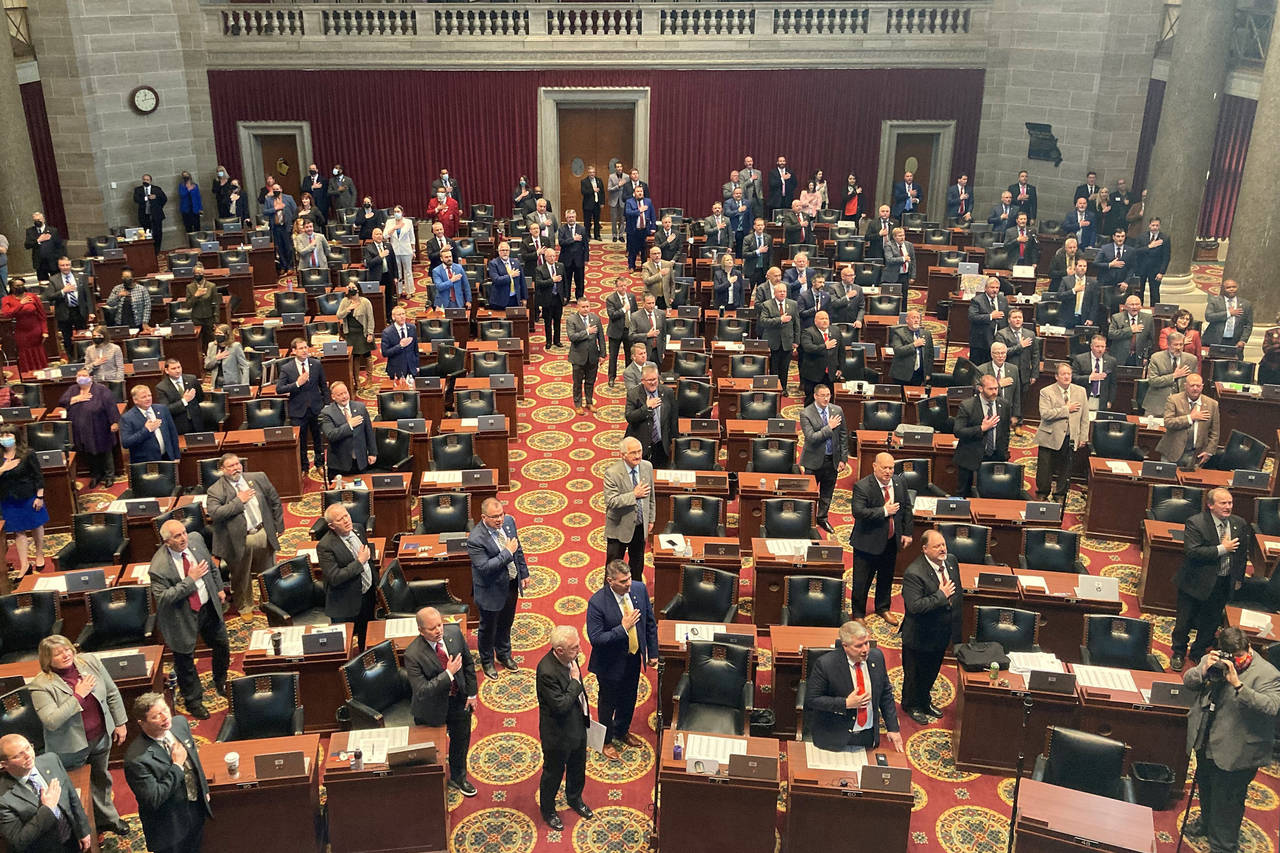 FILE - Members of the Missouri House of Representatives recite the Pledge of Allegiance as they beg...