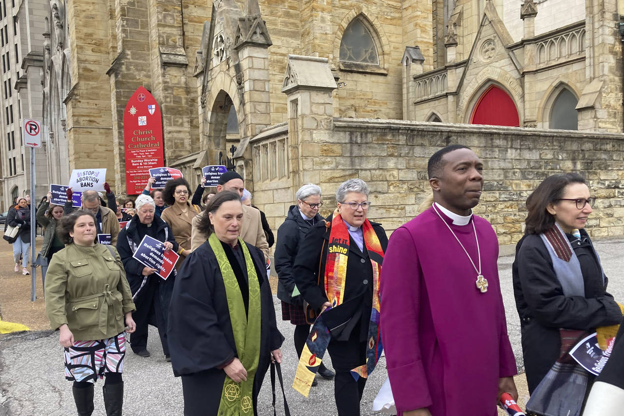 Clergy who filed suit seeking to overturn Missouri’s abortion law and other opponents of the law ...