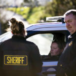 
              San Mateo Sheriffs protect the police line at the crime scene at Mountain Mushroom Farm, Tuesday, Jan. 24, 2023, after a gunman killed several people at two agricultural businesses in Half Moon Bay, Calif.  Officers arrested a suspect in Monday’s shootings, 67-year-old Chunli Zhao, after they found him in his car in the parking lot of a sheriff’s substation, San Mateo County Sheriff Christina Corpus said.  (AP Photo/Aaron Kehoe)
            