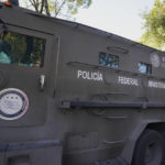 
              An armored transport drives out of the prosecutor's building where Ovidio Guzmán, one of the sons of former Sinaloa cartel boss Joaquin "El Chapo" Guzmán, is in custody in Mexico City, Thursday, Jan. 5, 2023. The Mexican military has captured Ovidio Guzman during a operation outside Culiacan, a stronghold of the Sinaloa drug cartel in western Mexico. (AP Photo/Fernando Llano)
            