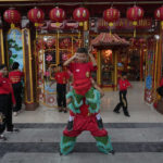 
              Children practice their dragon dance routines for the upcoming Chinese Lunar New Year celebrations outside the Hok Lay Kiong temple in Bekasi, Indonesia, Friday, Jan, 13, 2023. People of Chinese descent in the world's most populous Muslim country are preparing to celebrate the lunar New Year Year of the Rabbit on Jan. 22. (AP Photo/Achmad Ibrahim)
            