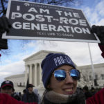
              With the U.S. Supreme Court in the background, an anti-abortion demonstrator holds a sign during the March for Life, Friday, Jan. 20, 2023, in Washington. (AP Photo/Alex Brandon)
            