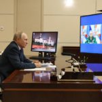 Russian President Vladimir Putin attends a videoconference with Russian Defense Minister Sergei Shoigu, left, on a tv screen, and Igor Krokhmal, commander of the frigate named "Admiral of the Fleet of the Soviet Union Gorshkov", right on a tv screen, in Moscow, Russia, Wednesday, Jan. 4, 2023. Putin on Wednesday sent a frigate off to the Atlantic Ocean armed with hypersonic Zircon cruise missiles. (Mikhail Klimentyev, Sputnik, Kremlin Pool Photo via AP)
