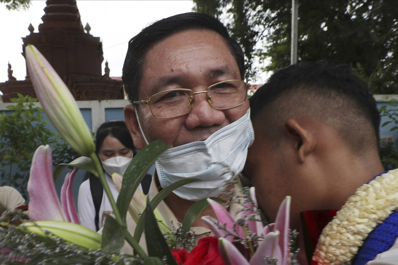 Thach Setha, left, a prominent vice president of the country's main opposition of Candlelight Party...