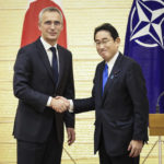 
              NATO Secretary-General Jens Stoltenberg, left, and Japan's Prime Minister Fumio Kishida shake hands after holding a joint media briefing on Tuesday, Jan. 31, 2023, in Tokyo. (Takashi Aoyama/Pool Photo via AP)
            