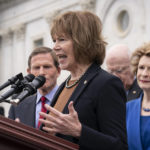 FILE - Sen. Tina Smith, D-Minn., joins other Democrats to express their outrage at a news report by Politico that a Supreme Court draft opinion suggests the justices could be poised to overturn the landmark 1973 Roe v. Wade case that legalized abortion nationwide, at the Capitol in Washington, Tuesday, May 3, 2022. (AP Photo/J. Scott Applewhite, File)