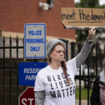 
              A group of demonstrators protest outside a police precinct in response to the death of Tyre Nichols, who died after being beaten by Memphis police officers, in Memphis, Tenn., Sunday, Jan. 29, 2023. (AP Photo/Gerald Herbert)
            