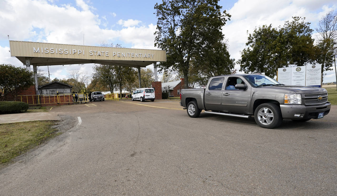 FILE - Traffic leaves the front gate to the Mississippi State Penitentiary in Parchman, Miss., Nov....