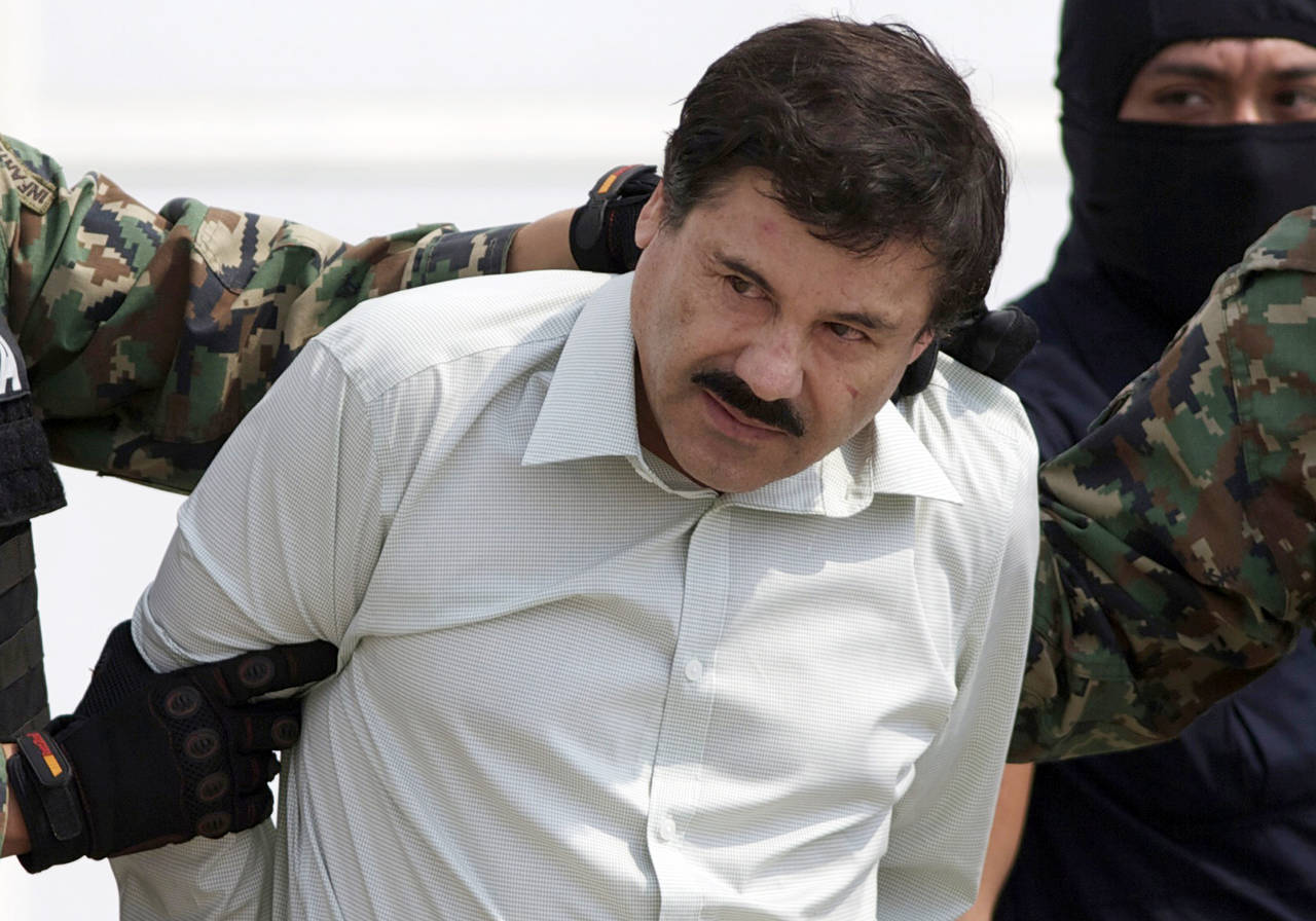 FILE - In this Feb. 22, 2014 file photo, Joaquin "El Chapo" Guzman, the head of Mexico's Sinaloa Ca...