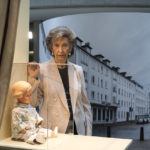 
              Holocaust survivor Lore Mayerfeld poses next to her doll 'Inge' as part of an exhibition with items from Israel's Yad Vashem Holocaust memorial in the German parliament Bundestag in Berlin, Germany, Monday, Jan. 23, 2023. An exhibition marking the 70th anniversary of Israel's Yad Vashem Holocaust memorial brings back to Germany a diverse set of everyday objects that Jews took with them when they fled the Nazis. (AP Photo/Markus Schreiber)
            