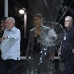 
              Brazil's President Luiz Inacio Lula da Silva inspects the damage at Planalto Palace after it was stormed by supporters of Brazil's former President Jair Bolsonaro in Brasilia, Brazil, Sunday, Jan. 8, 2023. Protesters who refuse to accept Bolsonaro´s election defeat stormed Congress, the Supreme Court and presidential palace in the capital, a week after the inauguration of his rival, President Luiz Inacio Lula da Silva. (AP Photo/Eraldo Peres)
            