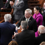 
              Rep. James Comer Jr., R-Ky., shakes hands with Rep. Kevin McCarthy, R-Calif., as he nominates him for speaker ahead of the 13th round of voting in the House chamber as the House meets for the fourth day to elect a speaker and convene the 118th Congress in Washington, Friday, Jan. 6, 2023. (AP Photo/Andrew Harnik)
            