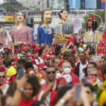 
              Supporters of President-elect Luiz Inacio Lula da Silva gather to attend his inauguration along the central avenue in Brasilia, Brazil, Sunday, Jan. 1, 2023. (AP Photo/Gustavo Moreno)
            