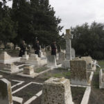 
              Hosam Naoum, a Palestinian Anglican bishop, walks with other clergy where vandals desecrated more than 30 graves at a historic Protestant Cemetery on Jerusalem's Mount Zion in Jerusalem, Wednesday, Jan. 4, 2023. Israel's foreign ministry called the attack an "immoral act" and "an affront to religion." Police officers were sent to investigate the profanation. (AP Photo/ Mahmoud Illean)
            