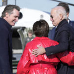 President Joe Biden greets Rep. Anna Eshoo, D-Calif., and California Gov. Gavin Newsom, left, after arriving on Air Force One at Moffett Federal Airfield in Mountain View, Calif., Thursday, Jan 19, 2023. (AP Photo/Susan Walsh)