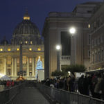 
              CORRECTS DATE TO JAN. 4 - Faithful arrive at dawn to view the body of Pope Emeritus Benedict XVI as it lies in state in St. Peter's Basilica at the Vatican, Wednesday, Jan. 4, 2023. The Vatican announced that Pope Benedict died on Dec. 31, 2022, aged 95, and that his funeral will be held on Thursday, Jan. 5, 2023. (AP Photo/Gregorio Borgia)
            