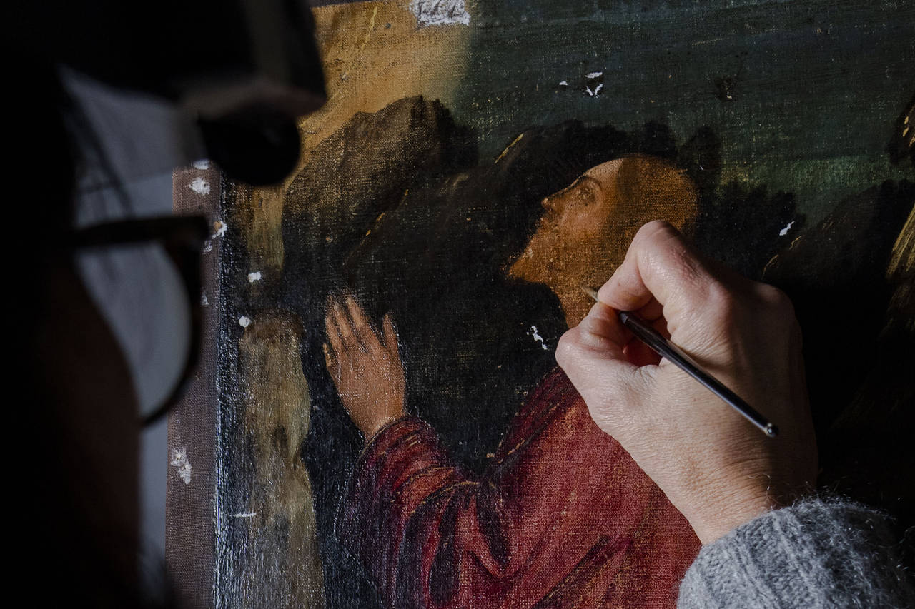 Restorer Valentina Piovan works on Vittore Carpaccio's 1502 painting 'The agony in the garden' at t...