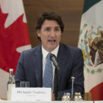 
              Canadian Prime Minister Justin Trudeau delivers opening remarks at a meeting with North American business leaders Monday, Jan. 9, 2023, in Mexico City, Mexico. (Adrian Wyld/The Canadian Press via AP)
            
