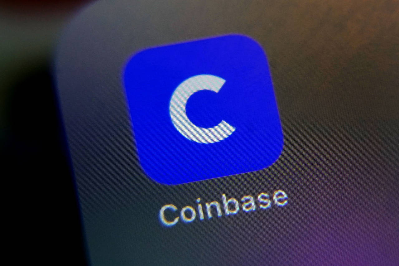 FILE - The mobile phone icon for the Coinbase app is shown in this photo, in New York, Tuesday, Apr...