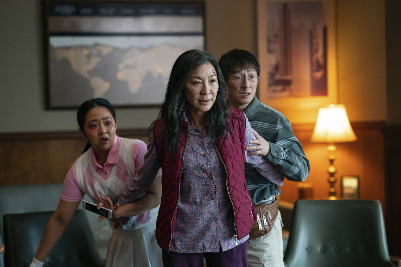 This image released by A24 Films shows, from left, Stephanie Hsu, Michelle Yeoh and Ke Huy Quan in ...