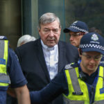 
              FILE - Cardinal George Pell, center, the most senior Catholic cleric to face sex charges, leaves court in Melbourne, Australia, May 2, 2018. Pell, who was the most senior Catholic cleric to be convicted of child sex abuse before his convictions were later overturned, has died Tuesday, Jan. 10, 2023, in Rome at age 81. (AP Photo/Asanka Brendon Ratnayake, File)
            