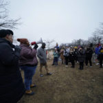 
              Amber Sherman of the group Decarcerate Memphis speaks to a group of demonstrators who gathered at dusk in Shelby Farms Park on Monday, Jan. 30, 2023, in Memphis, Tenn., in response to the death of Tyre Nichols, who died after being beaten by Memphis police officers. Nichols, who had a hobby in photography, frequented the park to photograph sunsets. (AP Photo/Gerald Herbert)
            