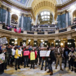 
              Protesters are seen in the Wisconsin Capitol Rotunda during a march supporting overturning Wisconsin's near total ban on abortion Sunday, Jan. 22, 2023, in Madison, Wis. (AP Photo/Morry Gash)
            
