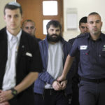 
              FILE - Yosef Haim Ben David, center, arrives at court in Jerusalem on March 22, 2016, during his murder trial in the death of a 16-year-old Palestinian boy. An Israeli group raising funds for Jewish radicals convicted in some of the country’s most notorious hate crimes, including Ben David, is collecting tax-exempt donations from Americans, according to an investigation by the AP and the Israeli investigative platform Shomrim. (AP Photo/Mahmoud Illean, File)
            