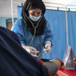 
              FILE - A Save the Children midwife provides Zarmina, 25, who is five months pregnant, with a pre-natal check-up in Jawzjan province in northern Afghanistan, Sunday, Oct. 2, 2022. (Save the Children via AP, File)
            